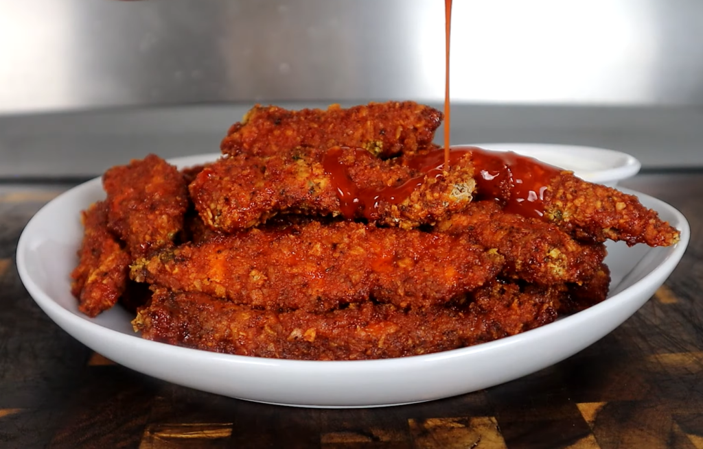 Make delicious Buffalo Chicken Tenders with our easy recipe! Perfect for parties, these tenders are crispy, spicy,